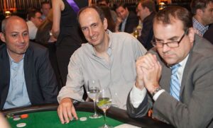 Wall Street investors play poker in Take 'Em to School event.