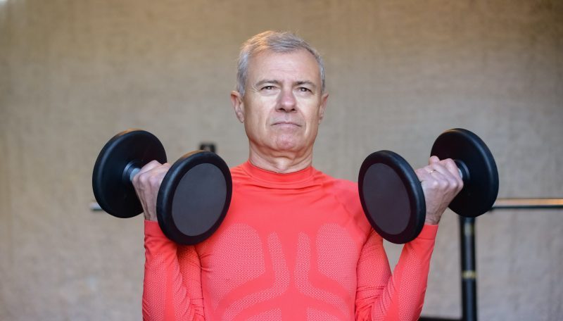 Picture of a man lifting weights