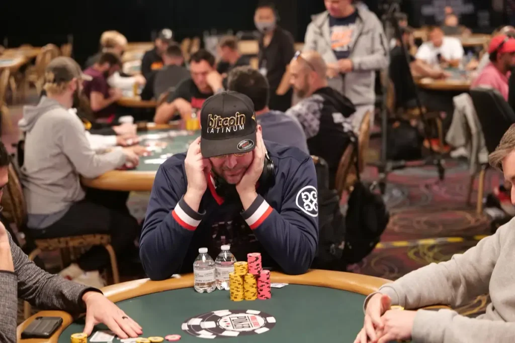 Poker player Phil Hellmuth in thought at the table