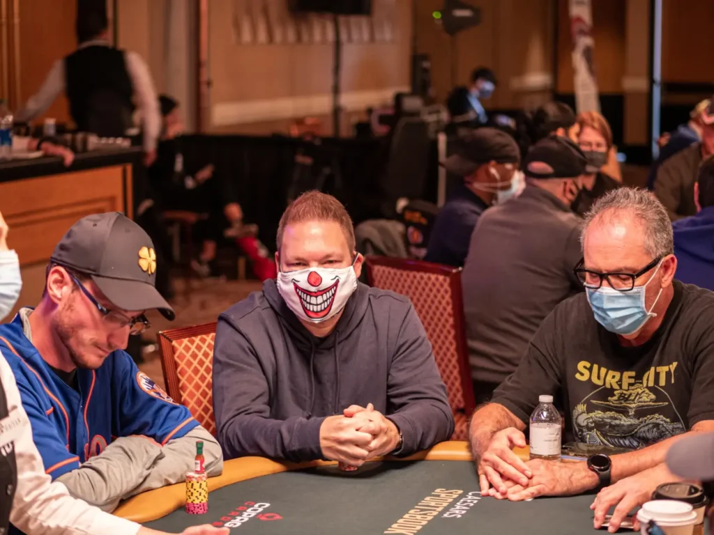 Poker player wearing COVID mask